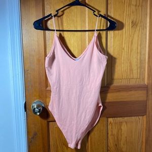 Peach colored bodysuit